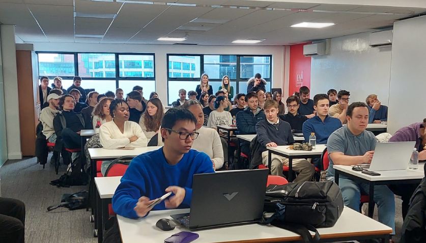 Students listening to the professor Students listening to the professor