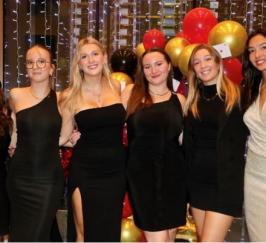 A group of women posing for a photo