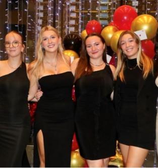 A group of women posing for a photo